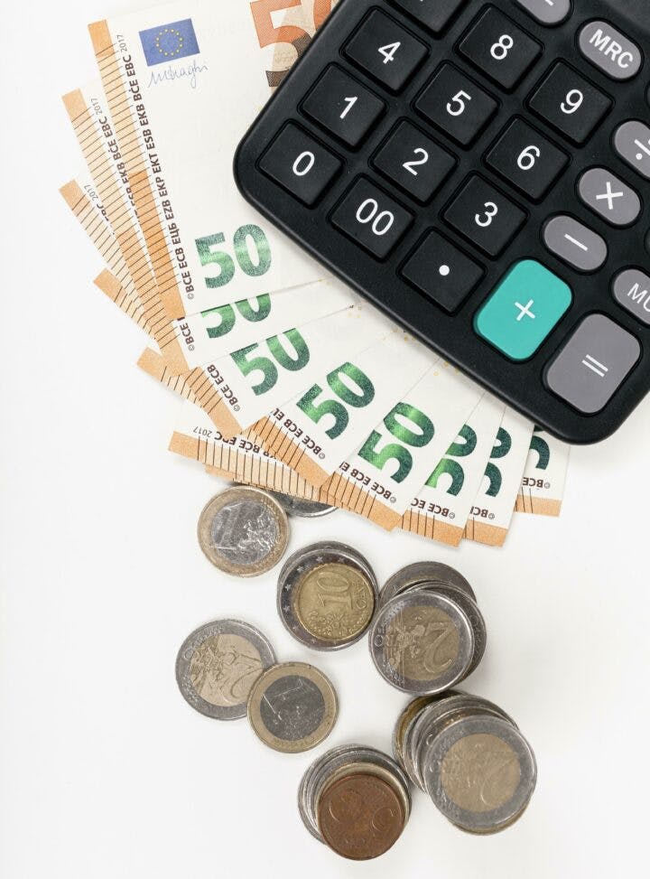 Bank notes coins with calculator